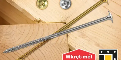 Dwa wkręty do krokwi, złoty i srebrny, leżą na drewnianych belkach. Logo "Wkręt-met KLIMAS" i "dmx".