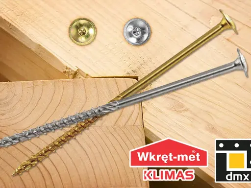 Dwa wkręty do krokwi, złoty i srebrny, leżą na drewnianych belkach. Logo "Wkręt-met KLIMAS" i "dmx".